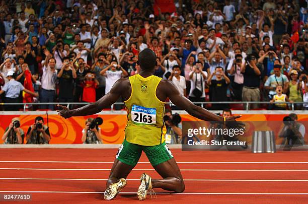 Usain Bolt of Jamaica reacts after breaking the world record with a time of 19.30 to win the gold medal in the Men's 200m Final at the National...
