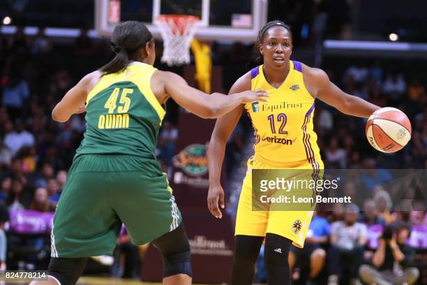 Chelsea Gray of the Los Angeles Sparks handles the ball against Noelle Quinn of the Seattle Storm during a WNBA basketball game at Staples Center on...