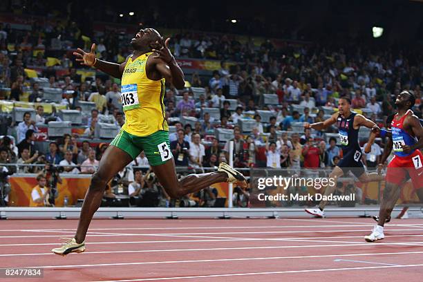 Usain Bolt of Jamaica reacts after breaking the world record with a time of 19.30 to win the gold medal in the Men's 200m Final at the National...