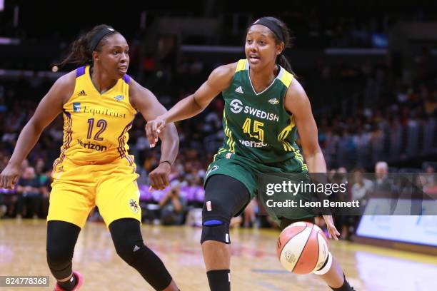 Noelle Quinn of the Seattle Storm handles the ball against Chelsea Gray of the Los Angeles Sparks during a WNBA basketball game at Staples Center on...