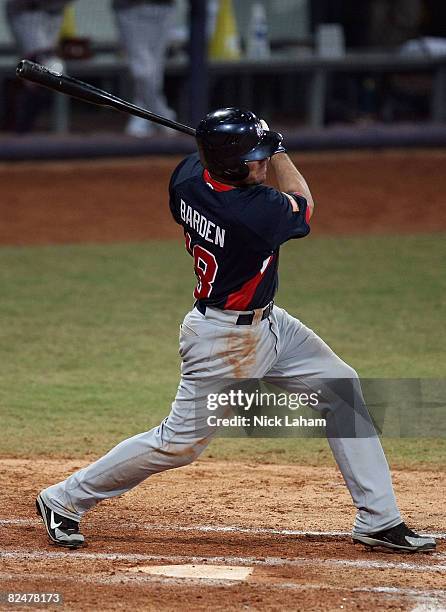 Brian Barden of the United States hits a RBI single to drive in Jason Donald to give the US a 3-2 lead in the top of the eleventh inning against...