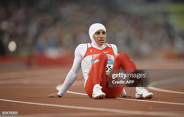 Bahrain's Roqaya al-Gassra reacts after failing to qualify for the final round following the women's 200m semi-final 2 at the "Bird's Nest" National...