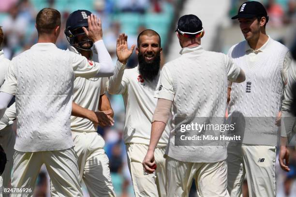 Moeen Ali of England celebrates with team mates after dismissing Chris Morris of South Africa during the 3rd Investec Test between England and South...