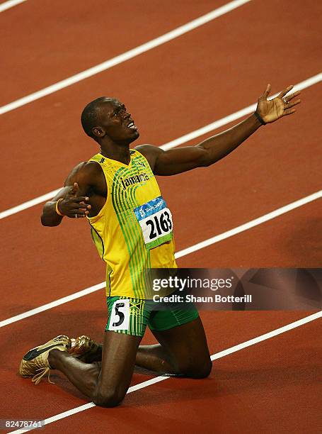 Usain Bolt of Jamaica reacts after breaking the world record with a time of 19.30 seconds to win the gold medal in the Men's 200m Final at the...