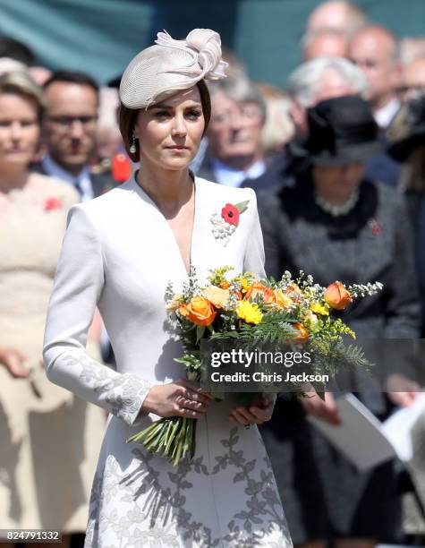 Catherine, Duchess of Cambridge with flowers during a ceremony at the Commonwealth War Graves Commisions's Tyne Cot Cemetery on July 31, 2017 in...