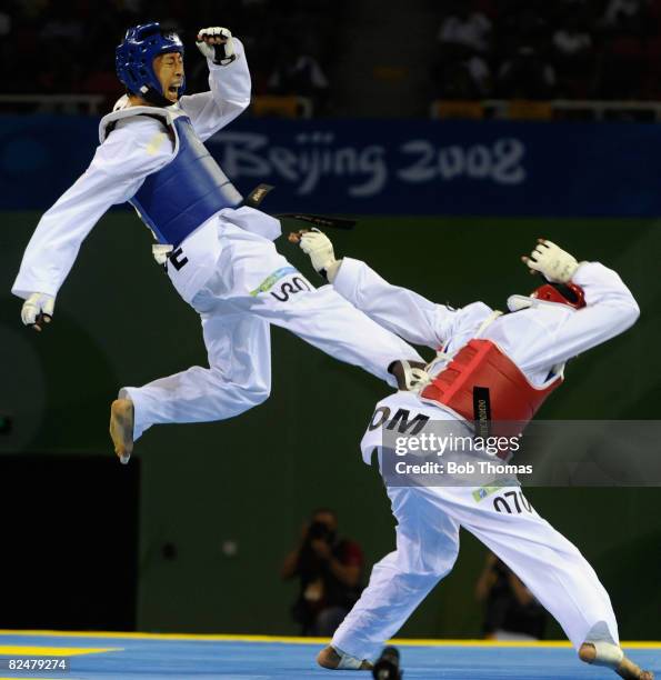 Mu-Yen Chu of Taipei competes against Yulis Gabriel Mercedes of Dominica in the Women's taekwondo -49kg at the University of Science and Technology...