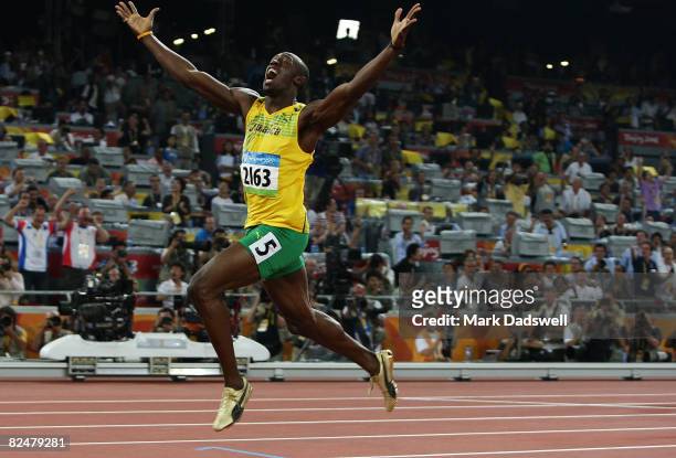 Usain Bolt of Jamaica reacts after breaking the world record with a time of 19.30 seconds to win the gold medal in the Men's 200m Final at the...