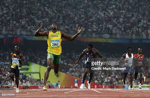 Usain Bolt of Jamaica competes on his way to breaking the world record with a time of 19.30 to win the gold medal in the Men's 200m Final against Kim...