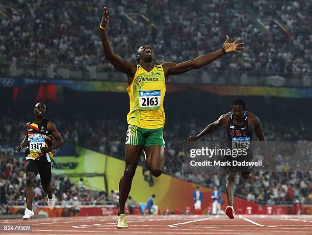 Usain Bolt of Jamaica competes on his way to breaking the world record with a time of 19.30 to win the gold medal in the Men's 200m Final against Kim...