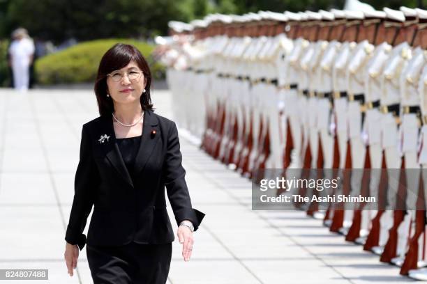 Outgoing Defense Minister Tomomi Inada reviews the honour guard at the Defense Ministry on July 31, 2017 in Tokyo, Japan.