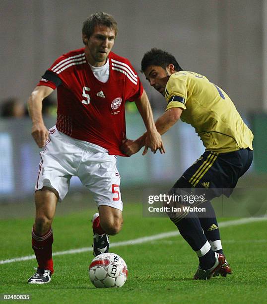 David Villa Sanchez of Spain tries to tackle Michael Silberbauer of Denmark during the International Friendly match between Denmark and Spain on...