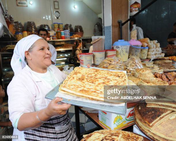 Trader presents cakes to customers to break the fast of Ramadan in the medina of Rabat on August 19, 2008. With the holy month of Ramadan...