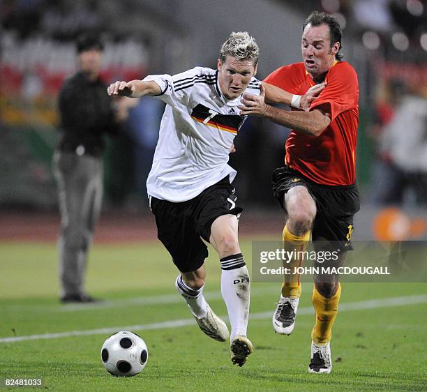 Belgium's midfielder Bart Goor vies with Germany's midfielder Bastian Schweinsteiger during the Germany vs Belgium international friendly football...