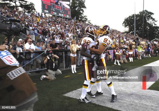 Wide receivers Antwaan Randle El and James Thrash of the Washington Redskins celebrate a catch against the Indianapolis Colts in the Pro Football...