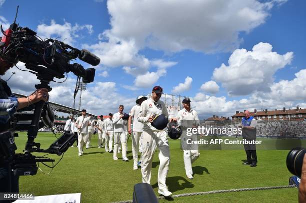 England's captain Joe Root and England's Jonny Bairstow celebrate as they leave the pitch after winning on the final day of the third Test match...