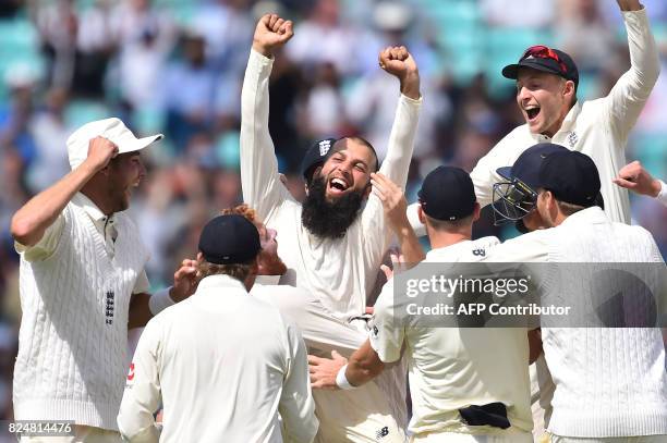 England's Moeen Ali and England cricketers celebrate victory on the fifth and final day of the third Test match between England and South Africa at...