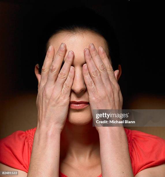 woman covering eyes - guess who stock pictures, royalty-free photos & images