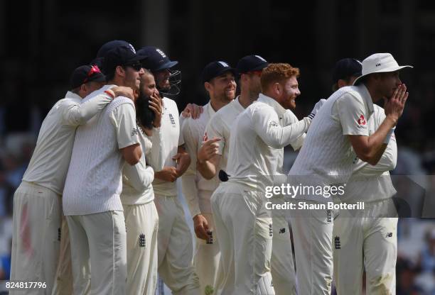 Moeen Ali of England and team-mates wait for the referee's decision for the wicket of Morne Morkel of South Africa for his hat-trick during day five...