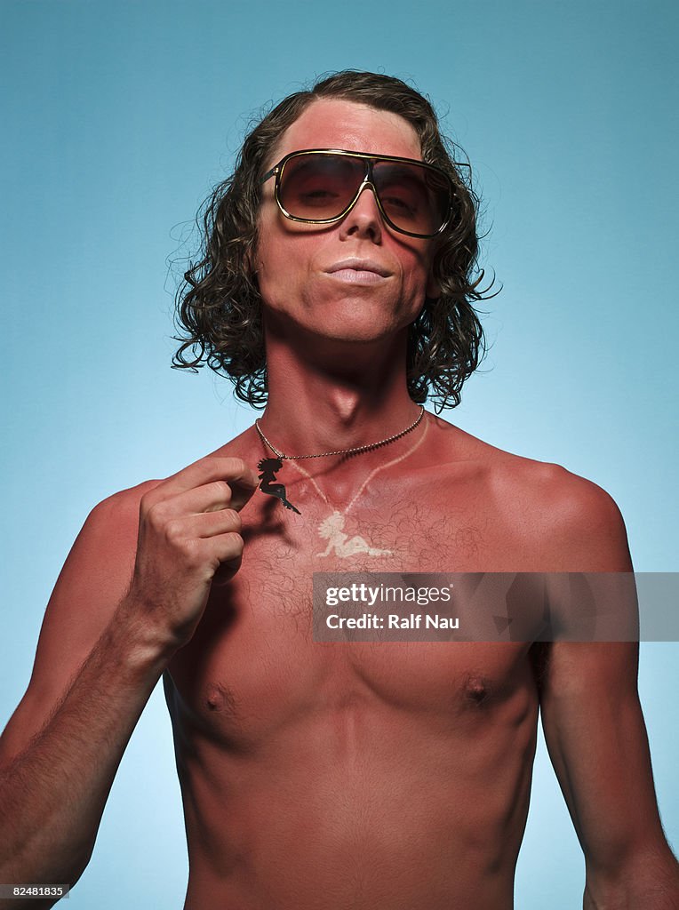 Sunburned male with outline of necklace