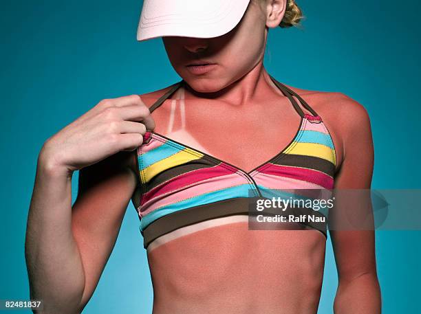 young girl looking at sunburn lines - endast en flicka bildbanksfoton och bilder