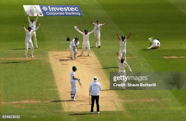 Moeen Ali of England takes the wicket of Morne Morkel of South Africa for his hat-trick during day five of the 3rd Investec Test match between...