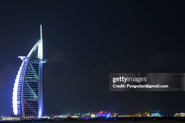 night view of burj al arab hotel dubai - burj al arab night stock pictures, royalty-free photos & images