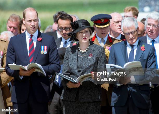 Prince William, Duke of Cambridge and Prime Minister Theresa May during a ceremony at the Commonwealth War Graves Commisions's Tyne Cot Cemetery on...