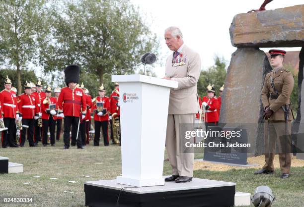 Prince Charles, Prince of Wales gives a reading as he attends the Welsh National Service of Remembrance at the Welsh National Memorial Park to mark...