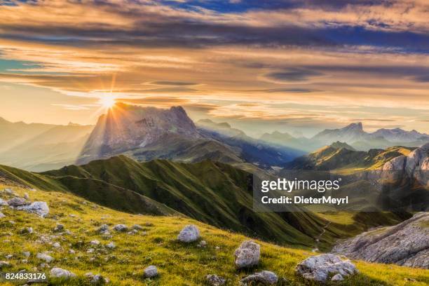 sunrise at sassolungo or langkofel mountain group, dolomites, trentino, alto adige - panoramic view stock pictures, royalty-free photos & images