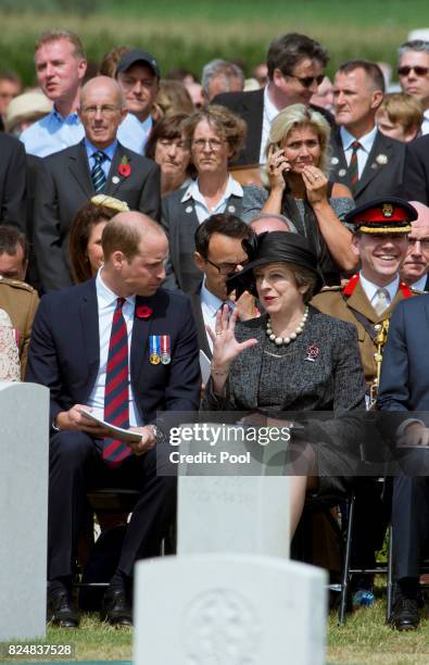 Prince William, Duke of Cambridge and Prime Minister Theresa May during a ceremony at the Commonwealth War Graves Commisions's Tyne Cot Cemetery on...