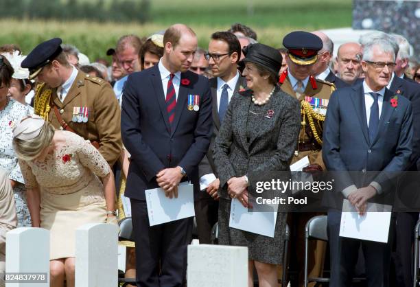 Prince William, Duke of Cambridge and Prime Minister Theresa May during a ceremony at the Commonwealth War Graves Commisions's Tyne Cot Cemetery on...