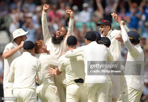 Moeen Ali and Joe Root of England celebrates after taking a hat trick when dismissing Morne Morkel during the fifth day of the 3rd Investec Test...