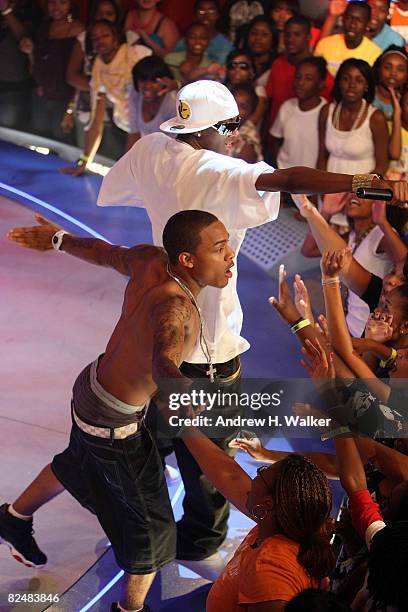 Recording artists Soulja Boy and Bow Wow perform at the taping of the 2,000th episode of "106 & Park" at the BET studios on August 19, 2008 in New...