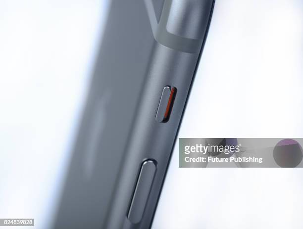 Detail of the volume and silent buttons on the side of an Apple iPhone 6s smartphone, taken on September 28, 2015.