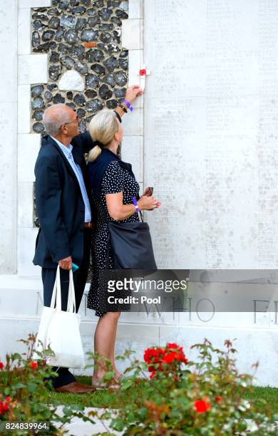 Relatives pay their respects during a ceremony at the Commonwealth War Graves Commisions's Tyne Cot Cemetery on July 31, 2017 in Ypres, Belgium. The...