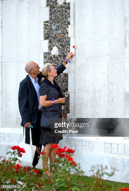 Relatives pay their respects during a ceremony at the Commonwealth War Graves Commisions's Tyne Cot Cemetery on July 31, 2017 in Ypres, Belgium. The...