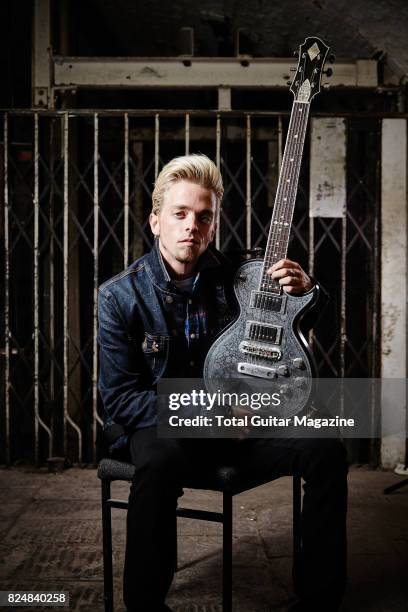 Portrait of American musician Ben Wells, guitarist with hard rock group Black Stone Cherry, photographed before a live performance at the Colston...