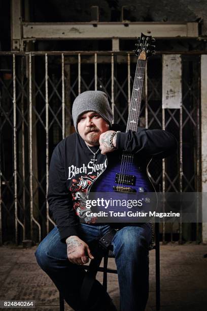 Portrait of American musician Chris Robertson, guitarist and vocalist with hard rock group Black Stone Cherry, photographed before a live performance...