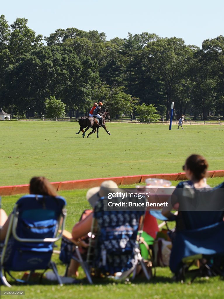Polo players take part in a match in Bethpage State Park on July 30