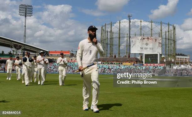 Moeen Ali of England leads the team off after winning the match with a hat trick in the 3rd Investec Test match between England and South Africa at...