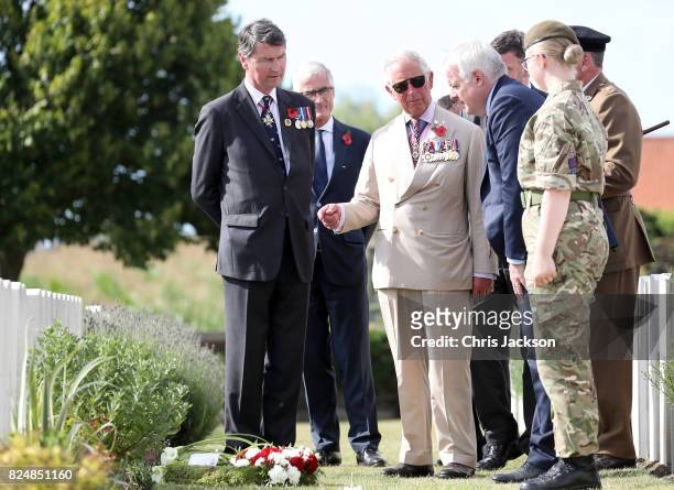 Prince Charles, Prince of Wales with Vice Admiral Sir Timothy Laurence and First Minister of Wales Carwyn Jones during a visit to Artillery Wood...