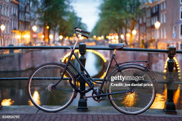 bokeh bicycle, amsterdam, holland - amsterdam bike stockfoto's en -beelden