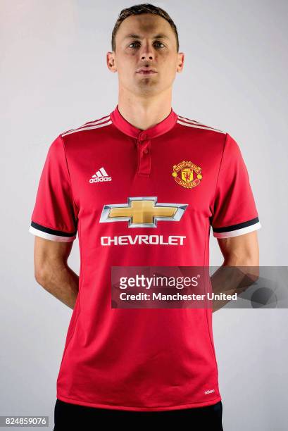 Nemanja Matic poses in a team shirt after signing for Manchester United at Aon Training Complex on July 31, 2017 in Manchester, England.