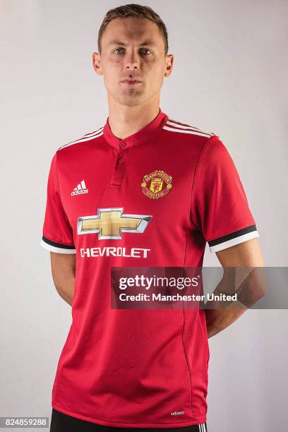 Nemanja Matic poses in a team shirt after signing for Manchester United at Aon Training Complex on July 31, 2017 in Manchester, England.