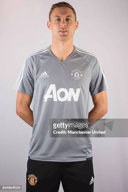 Nemanja Matic poses in a team shirt after signing for Manchester United at Aon Training Complex on July 31, 2017 in Manchester, England.