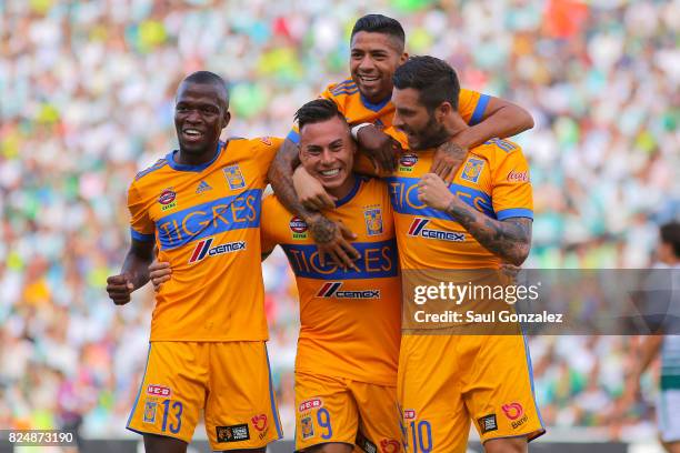 Eduardo Vargas of Tigres celebrates with teammates after scoring the first goal of his team during the 2nd round match between Santos Laguna and...