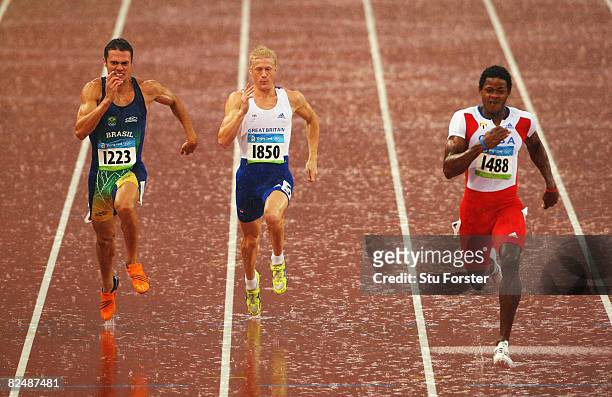Carlos Chinin of Brazil, Daniel Awde of Great Britain and Yordani Garcia of Cuba compete in the Men's Decathlon 100m Final held at the National...