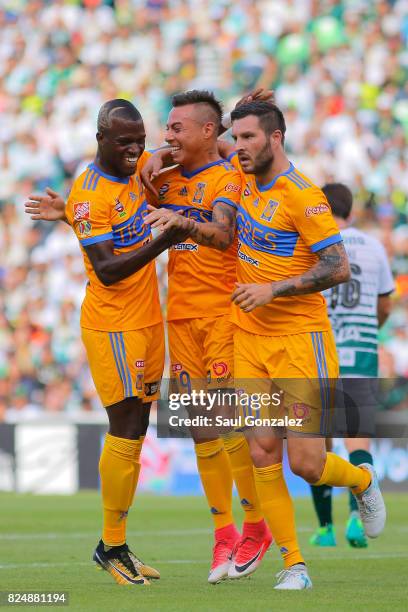 Eduardo Vargas of Tigres celebrates with teammates after scoring the first goal of his team during the 2nd round match between Santos Laguna and...