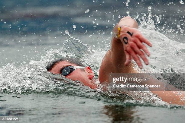 David Davies of Great Britain swims en route to a second place finish in the men's 10 km marathon swimming event held at the National Aquatics Center...