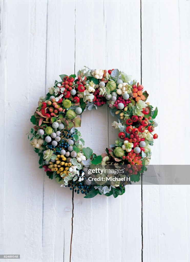 Wreath on the white wooden wall